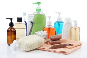 assorted personal hygiene products on white background